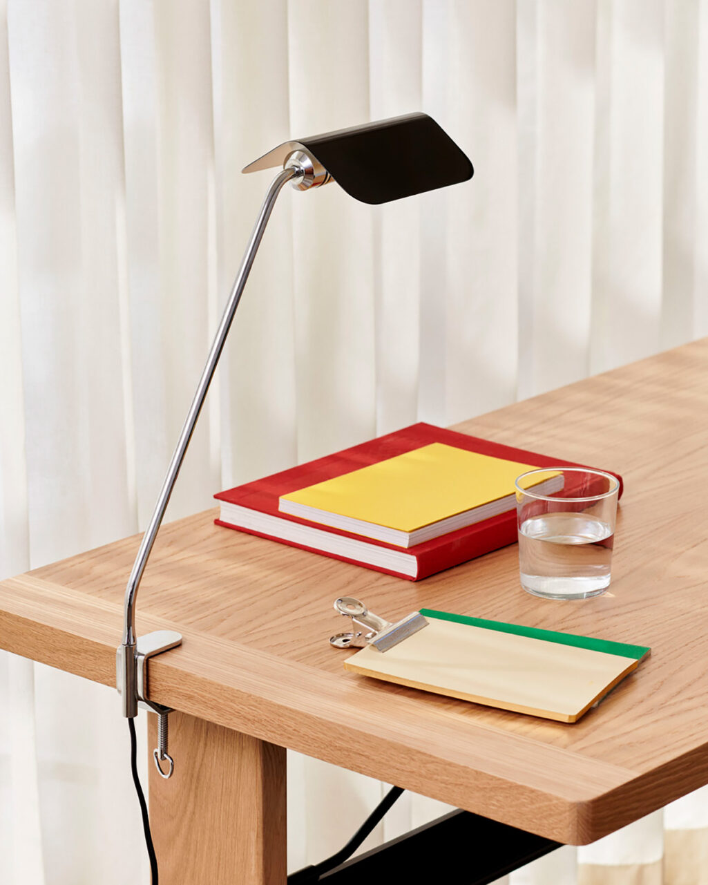 The Apex Clip Desk Lamp features a longer aluminium stem