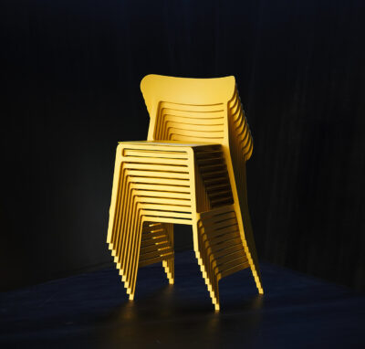 noho Lightly Chair stacked chairs yellow